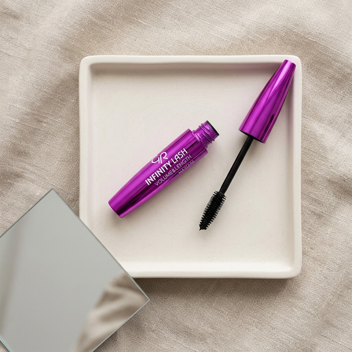 Golden Rose Infinity Lash mascara and brush on ivory vanity tray