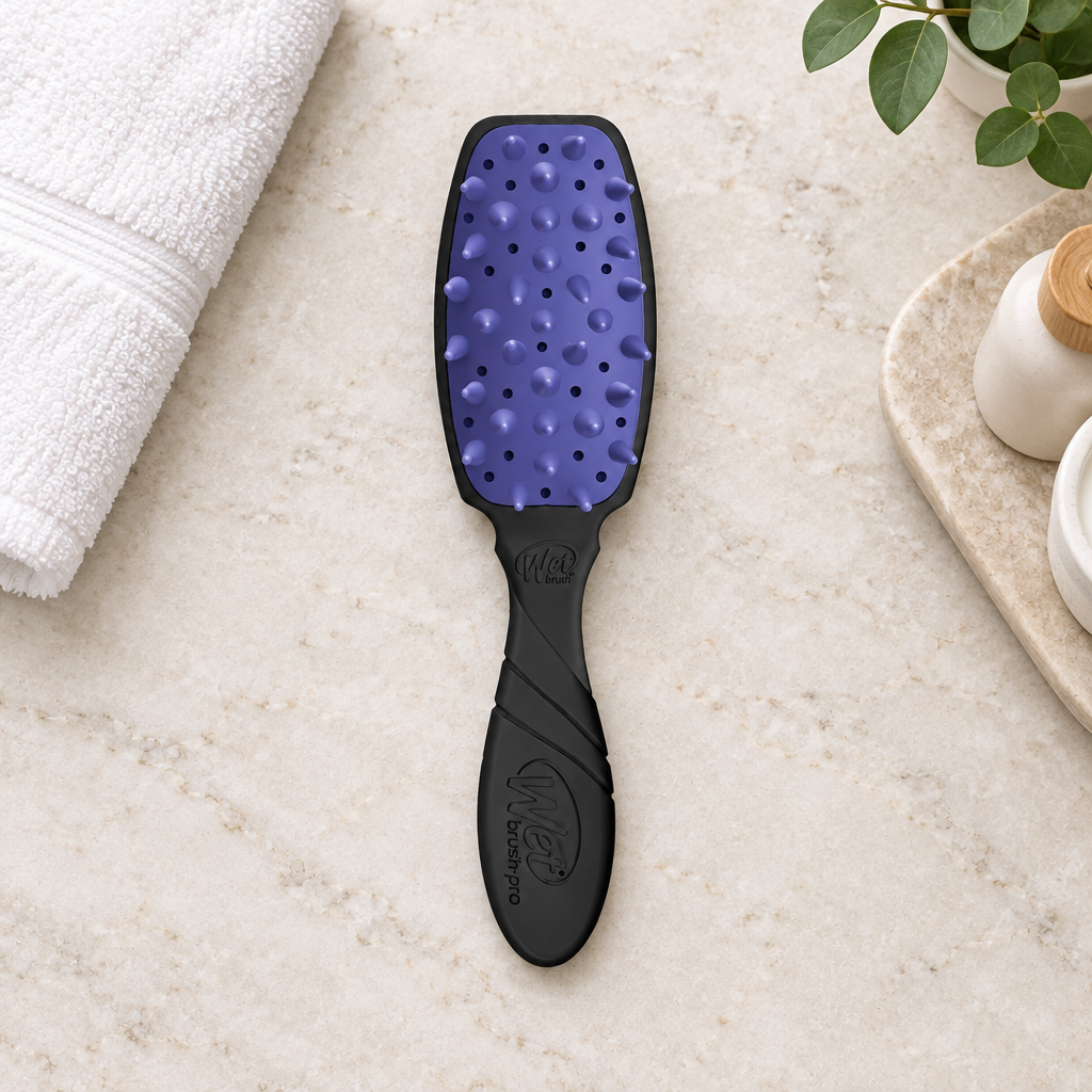 WetBrush Pro Treatment Brush on stone vanity