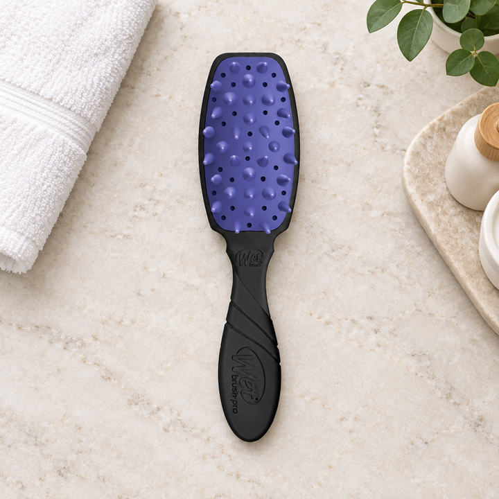 WetBrush Pro Treatment Brush on stone vanity