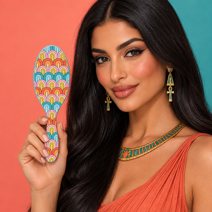 Model holding rainbow Wet Brush with its patterned back facing camera