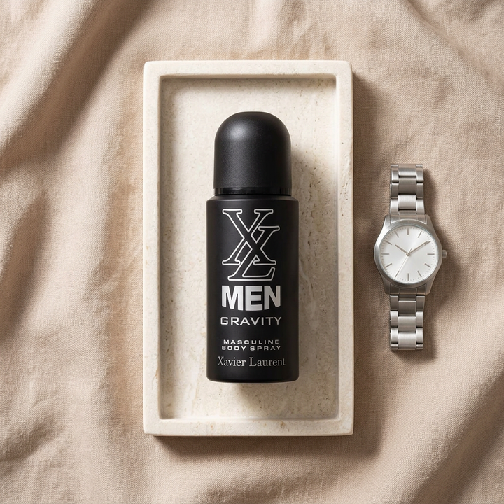 XL Men Gravity body spray on ivory tray beside a wristwatch