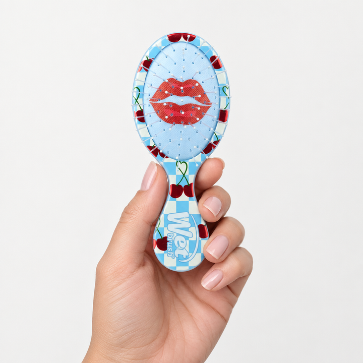 Compact Wet Brush Mini Detangler Rodeo Rebel Sweet Cherry held in hand for size