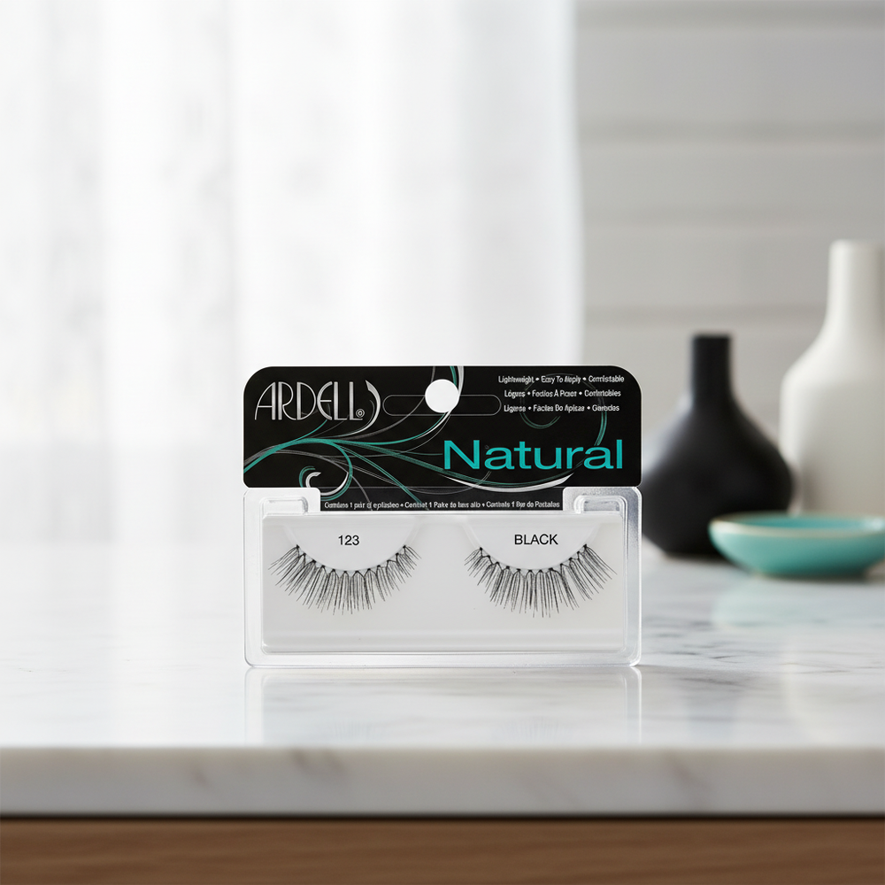 Ardell Natural 123 Black false eyelashes package in an elegant indoor setting