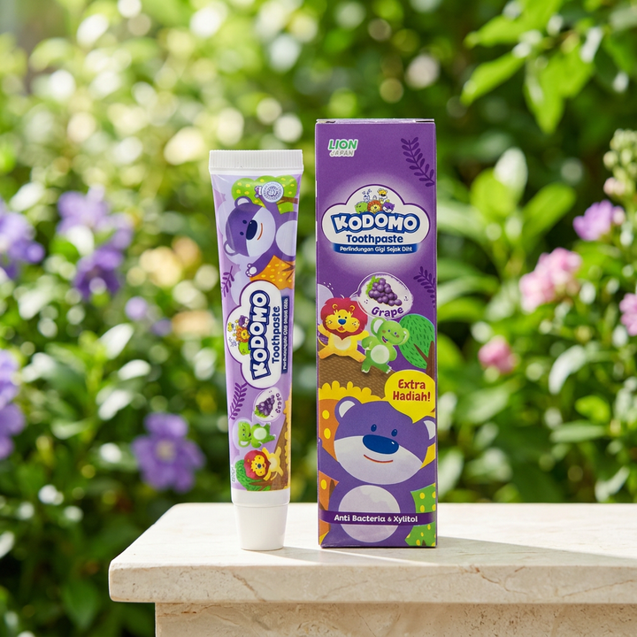 Kodomo Grape toothpaste tube and carton outdoors in natural light