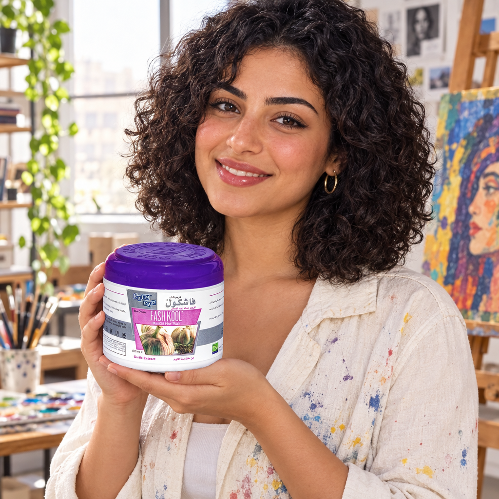 Model holding Fashkool Garlic Hair Mask jar in art studio