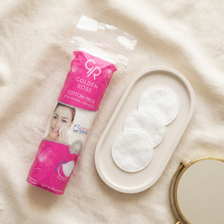 Golden Rose Cotton Pads package and round cotton discs on ivory tray