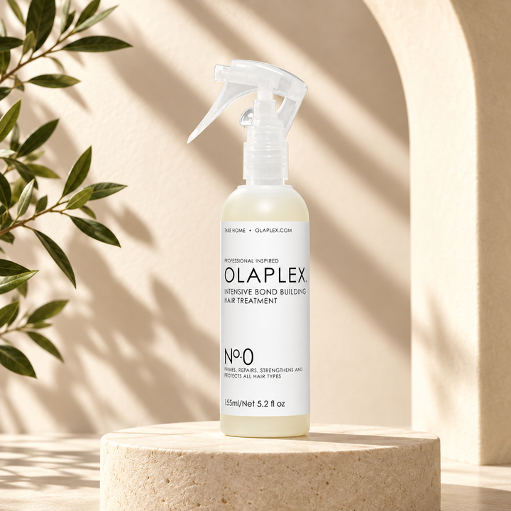 OLAPLEX No. 0 bottle on ivory pedestal