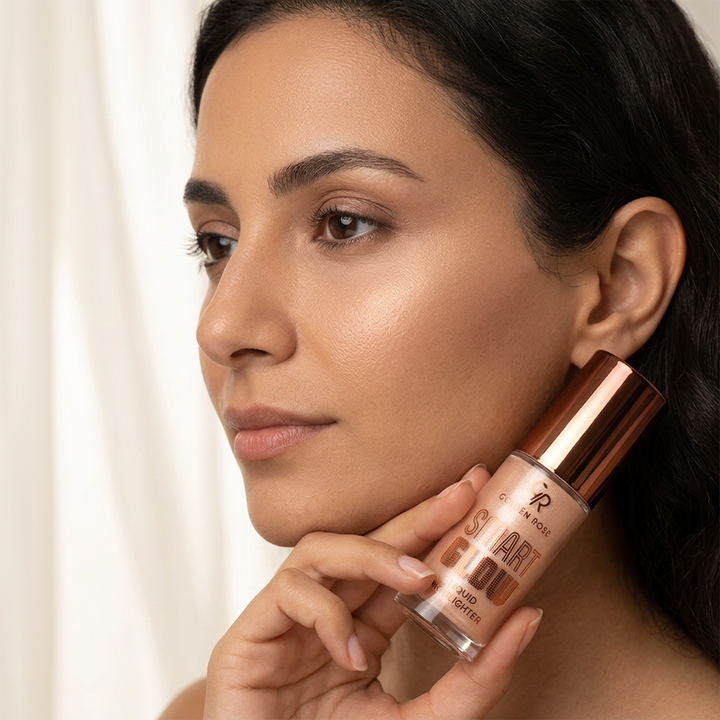 Egyptian beauty portrait holding Golden Rose Smart Glow liquid highlighter