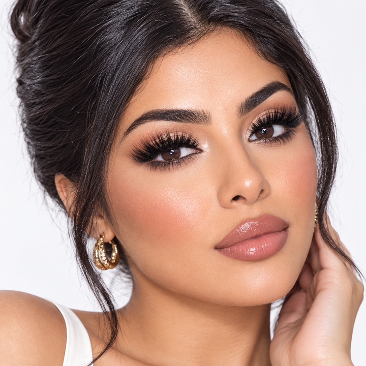 Model wearing KISS Lash Couture Bustler lashes