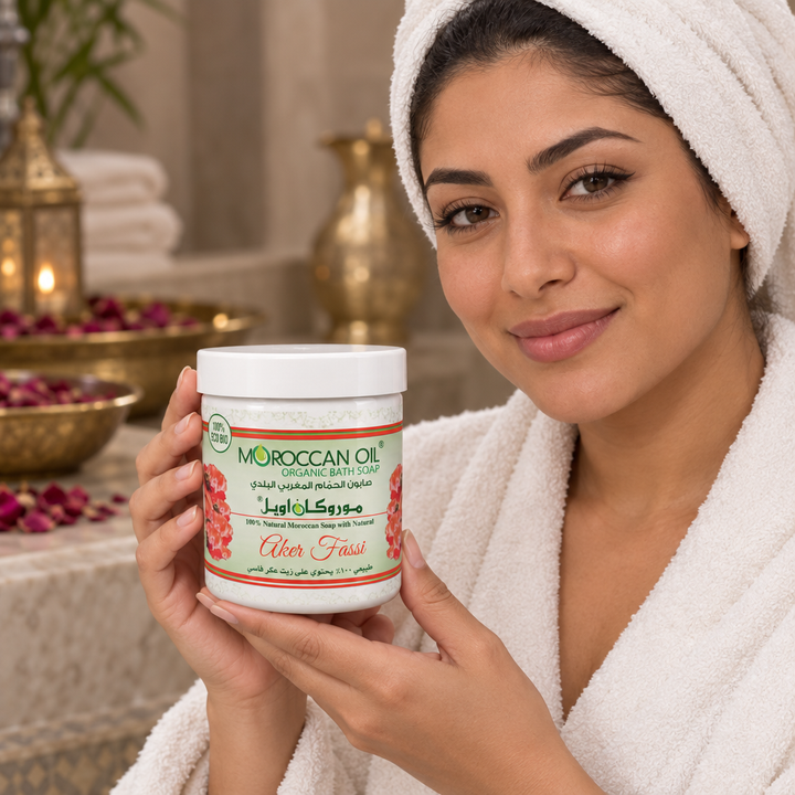 Model holding Moroccan Oil Aker Fassi bath soap