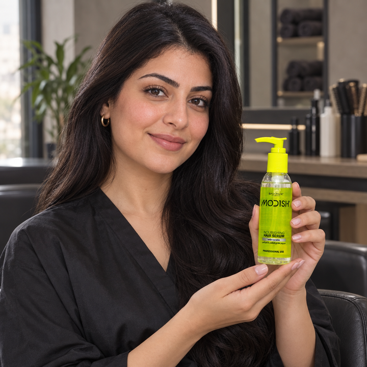 Model holding Modish Keratin hair serum