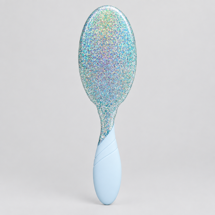 Indoor studio photo of glitter hairbrush