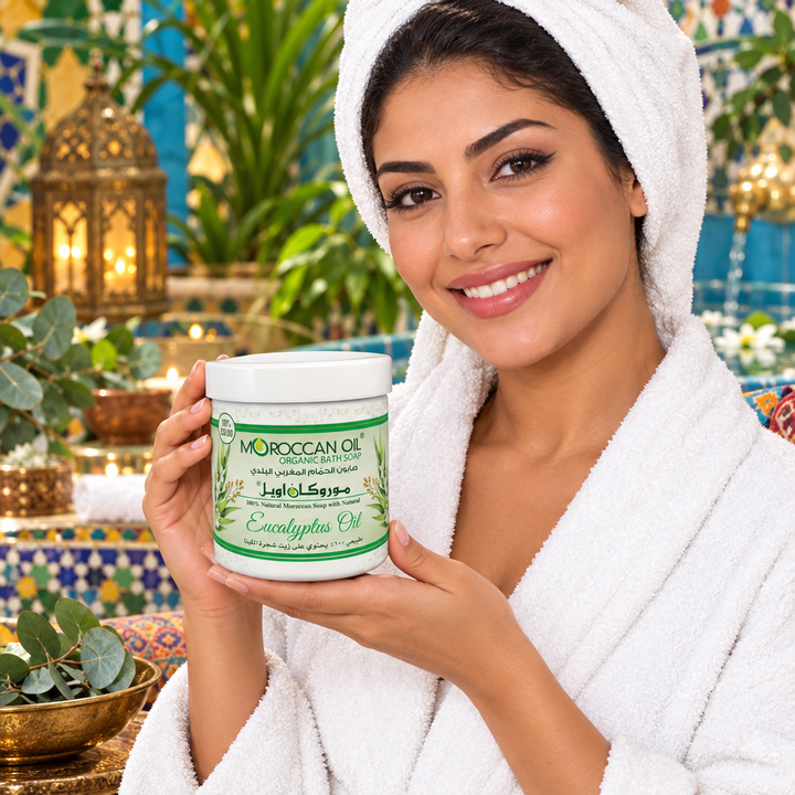 Model holding Moroccan Oil eucalyptus bath soap